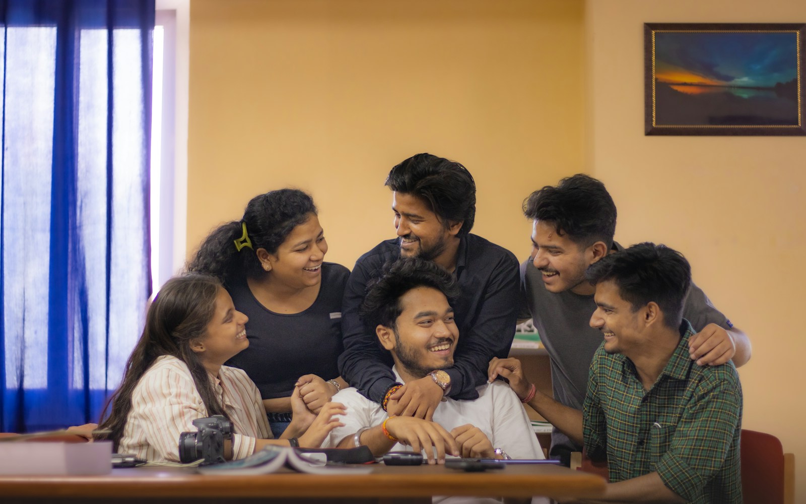 Indian students discussing around a laptop