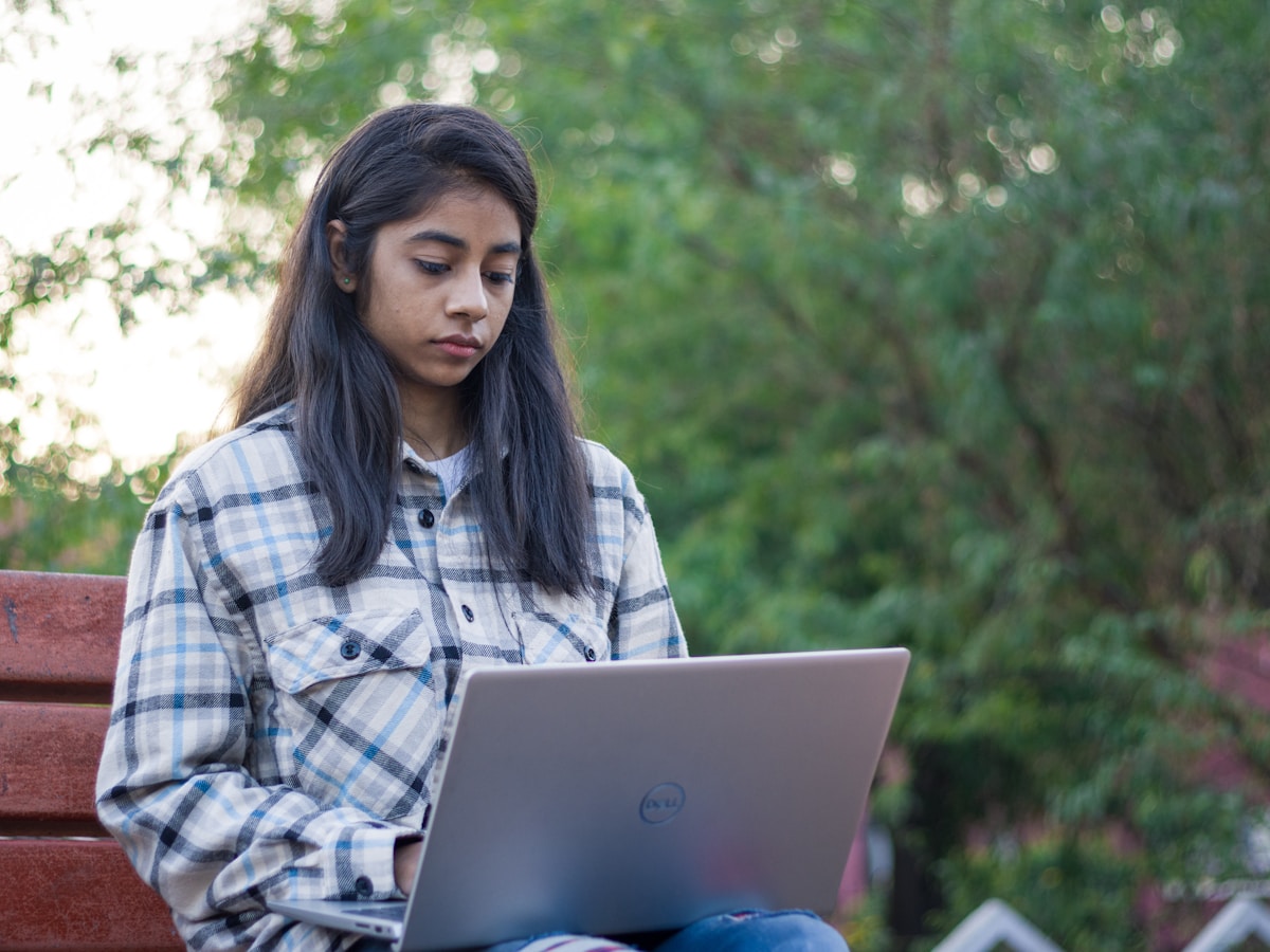 Indian woman student working on a laptop